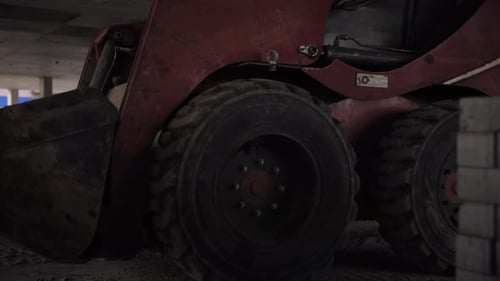 Skid Steer Parked Inside Building