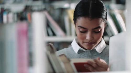 Student reading in a library