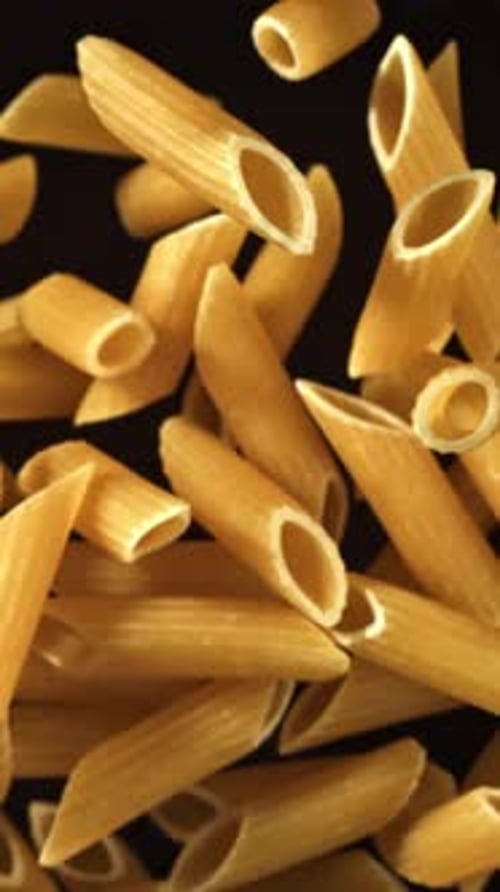Super Slow Motion Flying Dry Penne Pasta Filmed on a Highspeed Camera at 1000 Fps