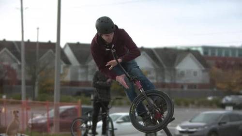 Extreme sports slow motion bar spin on BMX bike in skatepark.mov