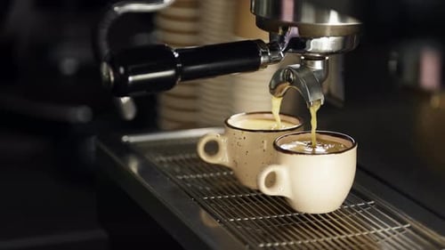 Coffee Pours Into Two Cups From Machine