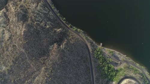 AERIAL - Overhead Drone Shot of Road Next to Lake (Canyon Lake)