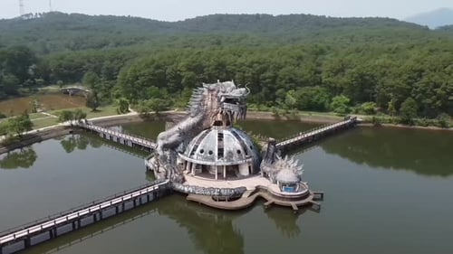 Aerial of Ho Thuy Tien abandoned water park with huge dragon structure