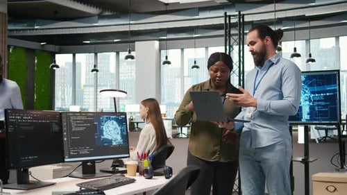 Teamworking Programmers in Office Reviewing AI System Metrics