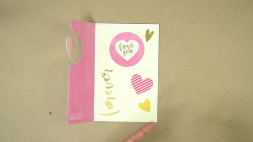 Hands Crafting DIY Greeting Card with Stickers