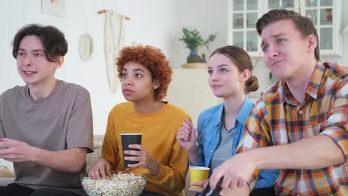 Home Party Cheerful Group of Friends Playing Video Games at Home Happy Diverse Group Buddies Having