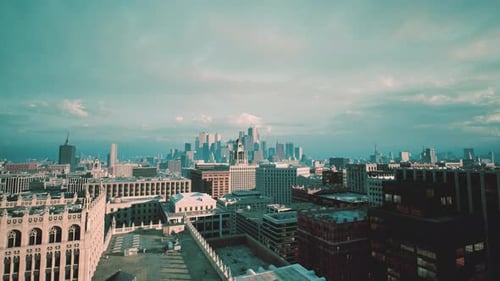Modern City Skyline Aerial Flyover with Clouds
