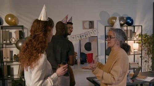 Colleagues Celebrate Birthday in Office with Drinks and Balloons