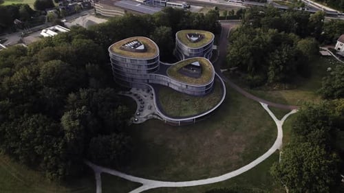 Aerial approach of contemporary architecture in park of Triodos financial institute green fund finan