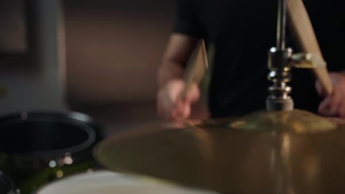 Drummer Playing Cymbal with Drumsticks Close Up