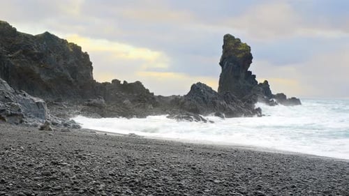 Volcanic Ocean Coastline with Black Cliff in Iceland