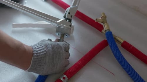 Expanding Plastic Pipe with Pipe Expander Before Fitting Installation
