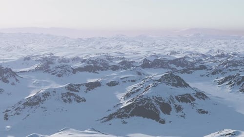 A Snowcovered Mountain Range with Majestic Peaks in the Background