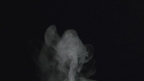 Wispy Smoke Flowing Upwards on Black Background