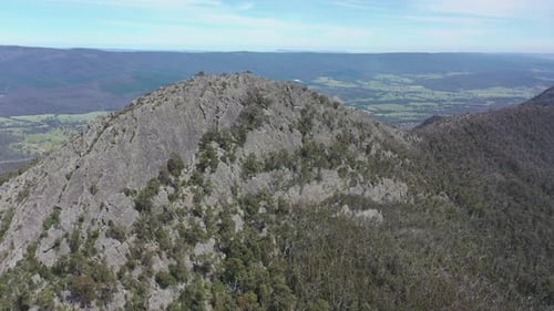 Rugged and fractured Sugarloaf mountain rock in approaching aerial