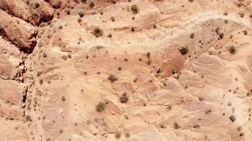 Birdseye Aerial View of Sandstone Hills in Nevada Desert. Flying Over Dry Landscape