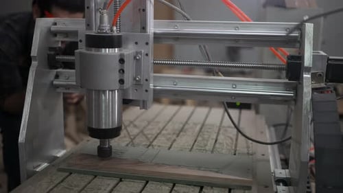 Carpenter is working at workshop.