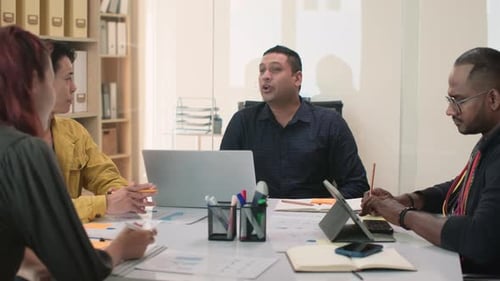 Team Meeting Discussion in Modern Office