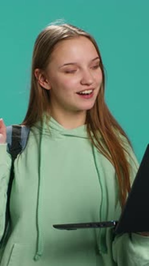 Young Woman Using Laptop for Video Call