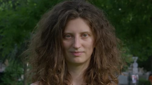 Close-Up Portrait of Woman with Long Wavy Hair