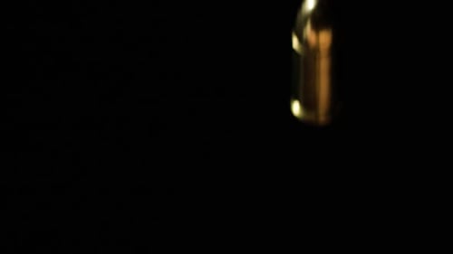 9mm Parabellum Firearm Cartridges And .300 AAC Blackout Falling Against Black Background. - close up