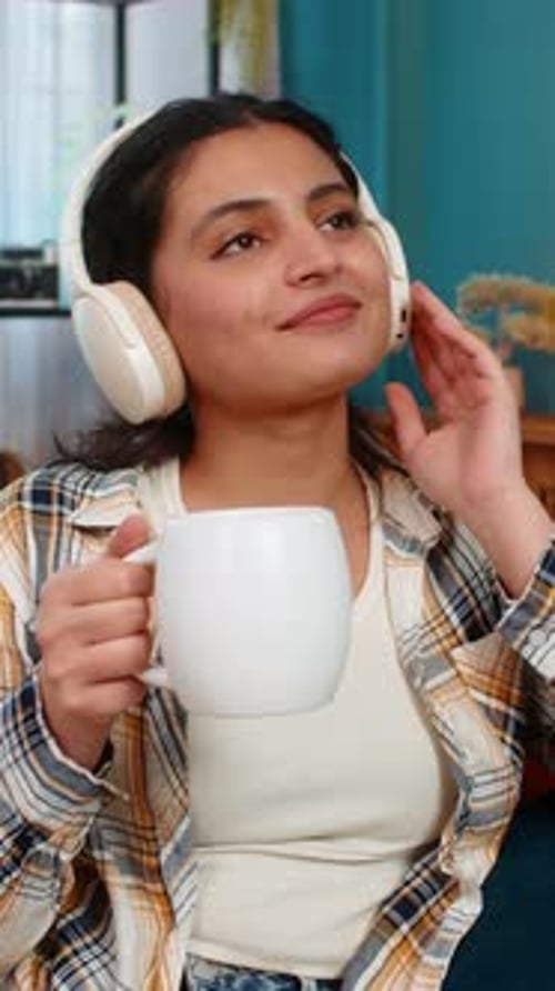 Woman Drinking Tea, Relaxing with Headphones
