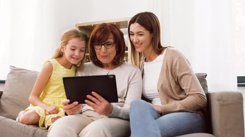 Family Video Chatting on Tablet at Home