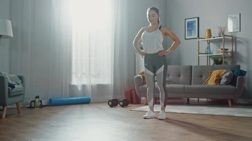 Strong and Beautiful Athletic Fitness Girl in Sportswear is Doing Forward Lunge Exercises in Her Br