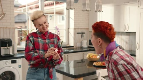 Lesbian Couples Heartfelt Home Proposal Sealed with a Ring Symbolizing Commitment