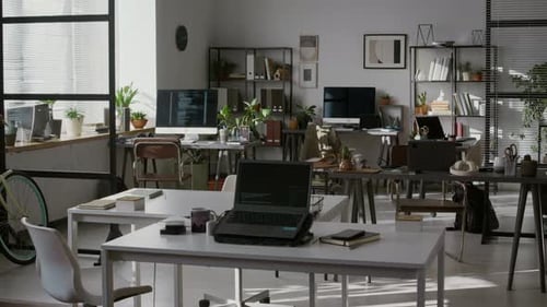 Interior of Spacious Modern Office with Work Desks and Computers
