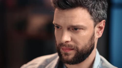 Bearded Man Close-Up Indoors Looking Down