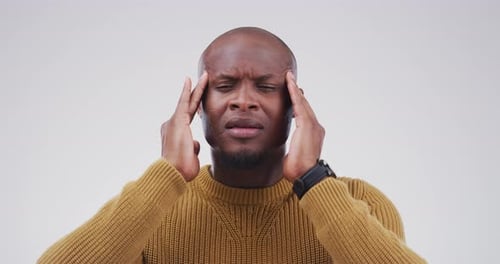 Man Massaging Temples With Headache or Pain