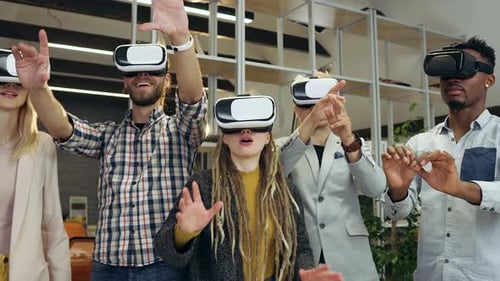 Close up of international people coworkers which working on imaginary screen using virtual reality