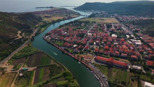 Aerial view of Temo river and red rooftops, Italy.