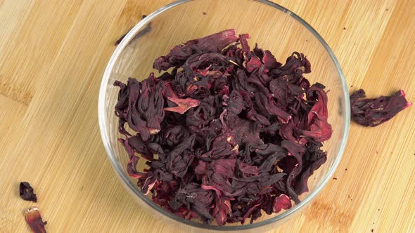 Hibiscus tea leaves rotate in a glass bowl. Dried hibiscus leaves for ...