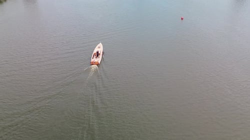 Pleasure Boat Cruising on Open Water From Above