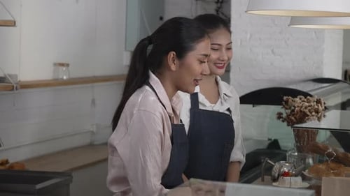 Entrepreneur and team are working at bakery and coffee shop.