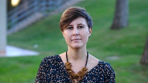 youth, beauty - young confident woman at park looks at camera