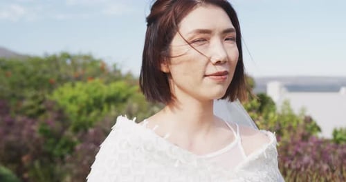 Beautiful Bride Smiling Outdoors on Wedding Day