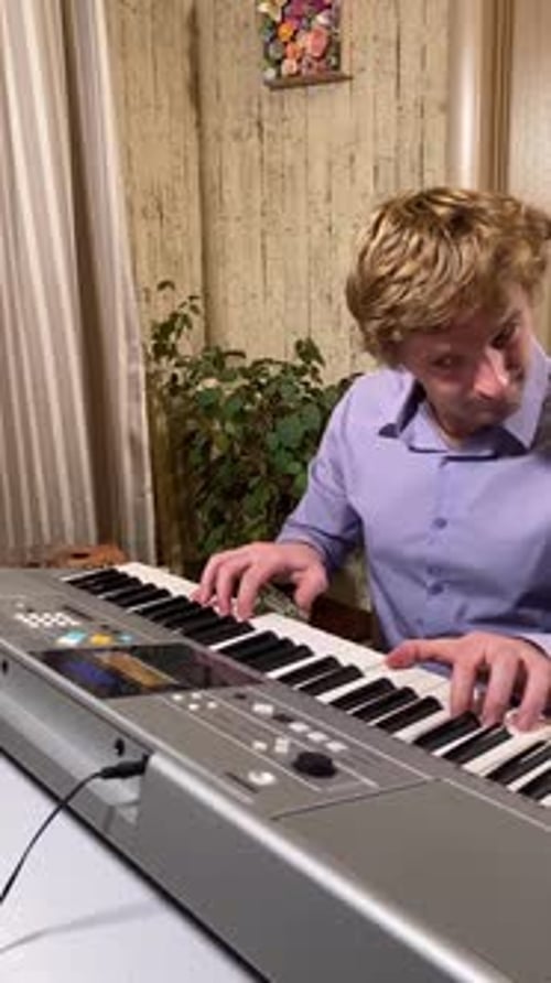 Father and Son Playing Keyboard and Guitar Together