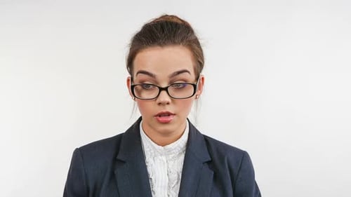 Shocked Young Woman in Blazer, Close Up