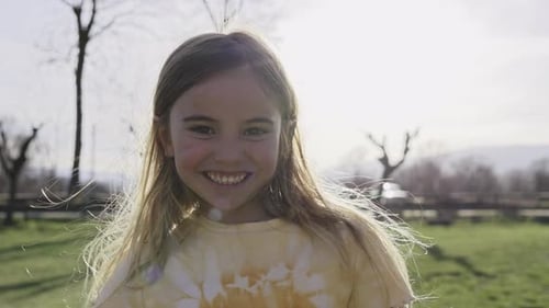Happy Child Smiling in a Sunny Field