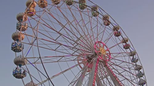Ferris Wheel In Amusement Park On A Cloudless Day