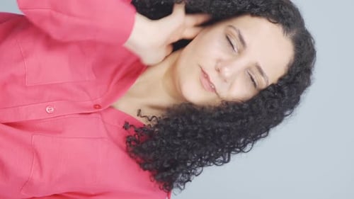 Woman Rubbing Her Neck and Head