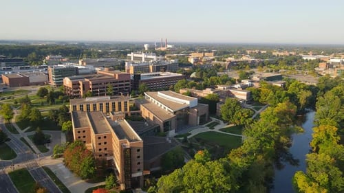 Michigan State University facility on sunny summer evening, aerial drone view