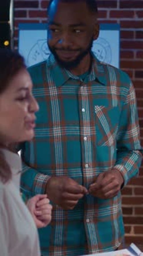 Vertical Video Businessman and Businesswoman Presenting Company Marketing Statistics Visualization