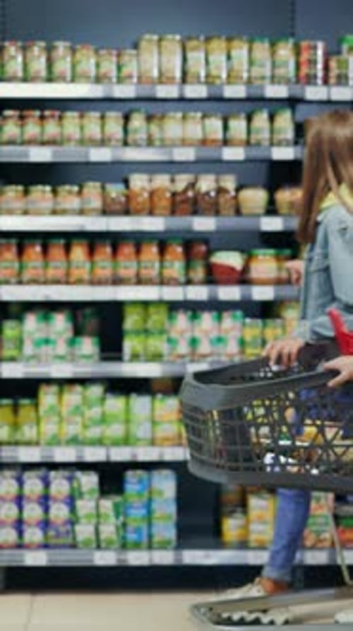 In Supermarket Grocery Store Young Happy Family Kids and Parents Walking Through Sections Choosing