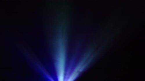 Purple Light From Projector Illuminating The Dark