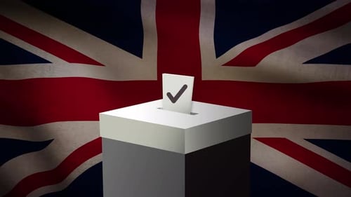 Casting Vote Into The Ballot Box During Uk Election