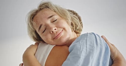 Happy Women Embracing in a Close Up